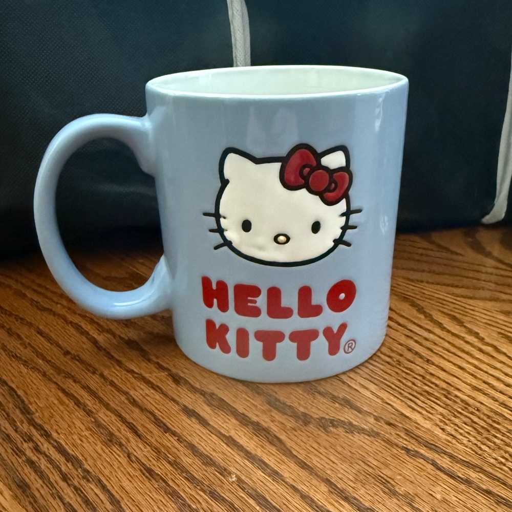 Hello Kitty Ceramic Coffee Cup/Mug with Blue, red and Black Design. NWOT